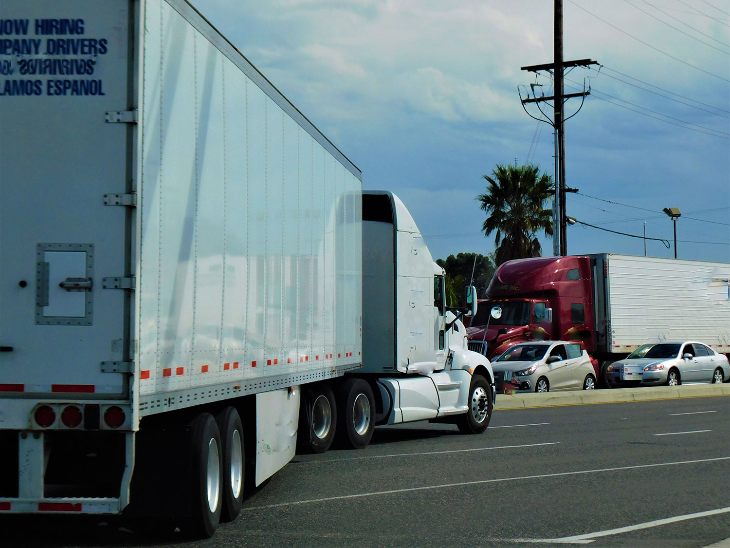 18-wheeler commercial truck driving into traffic