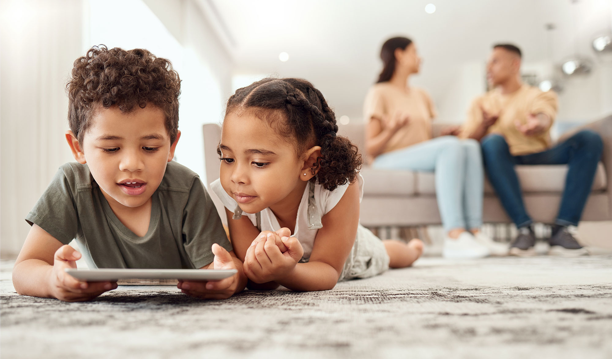 Children playing video games on a tablet
